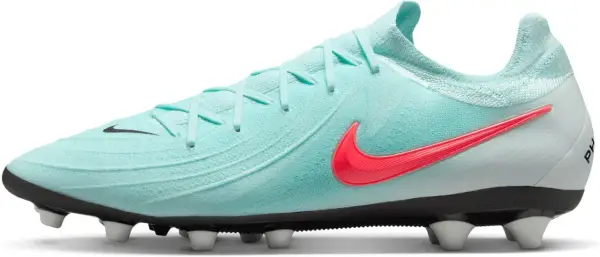 Turkusowe korki Nike z jaskrawym logo, idealne na jakie korki na orlik. Gotowe do gry!